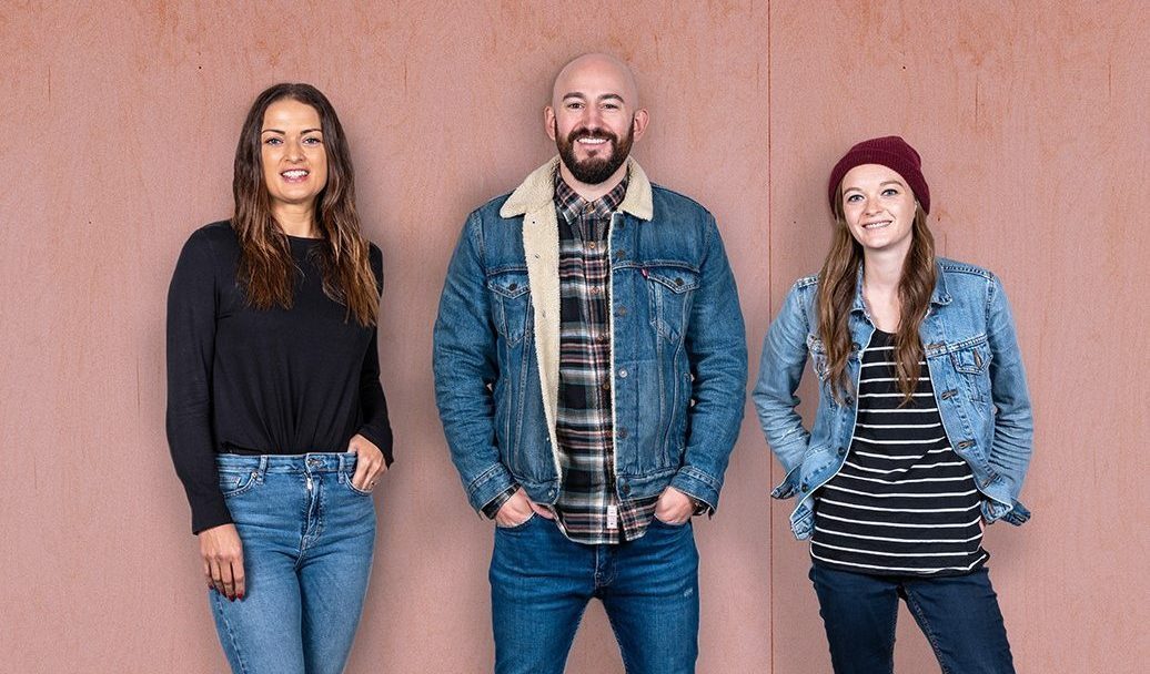 D4R team standing in front of a pink wall